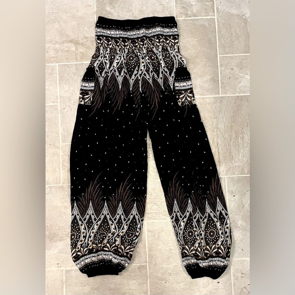 Black, tan and white baggy/yoga pants. Size small.
